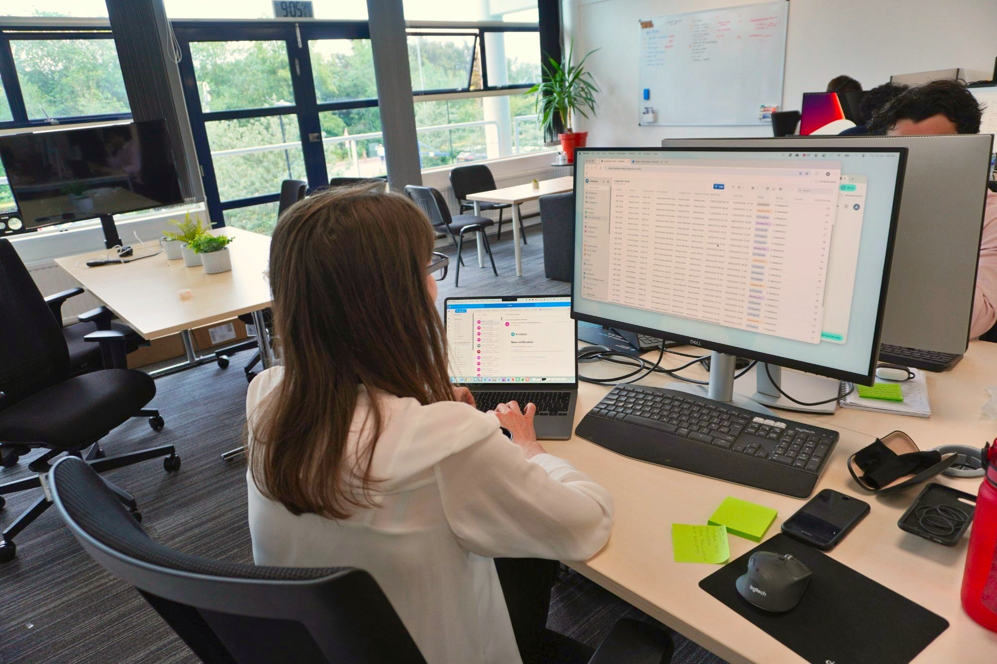 Alena building a client system in Kinabase at her desk