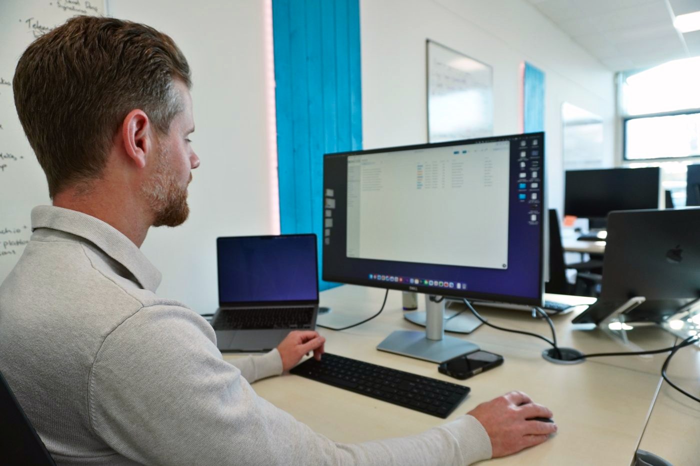 One of our team at his desk building a client’s system