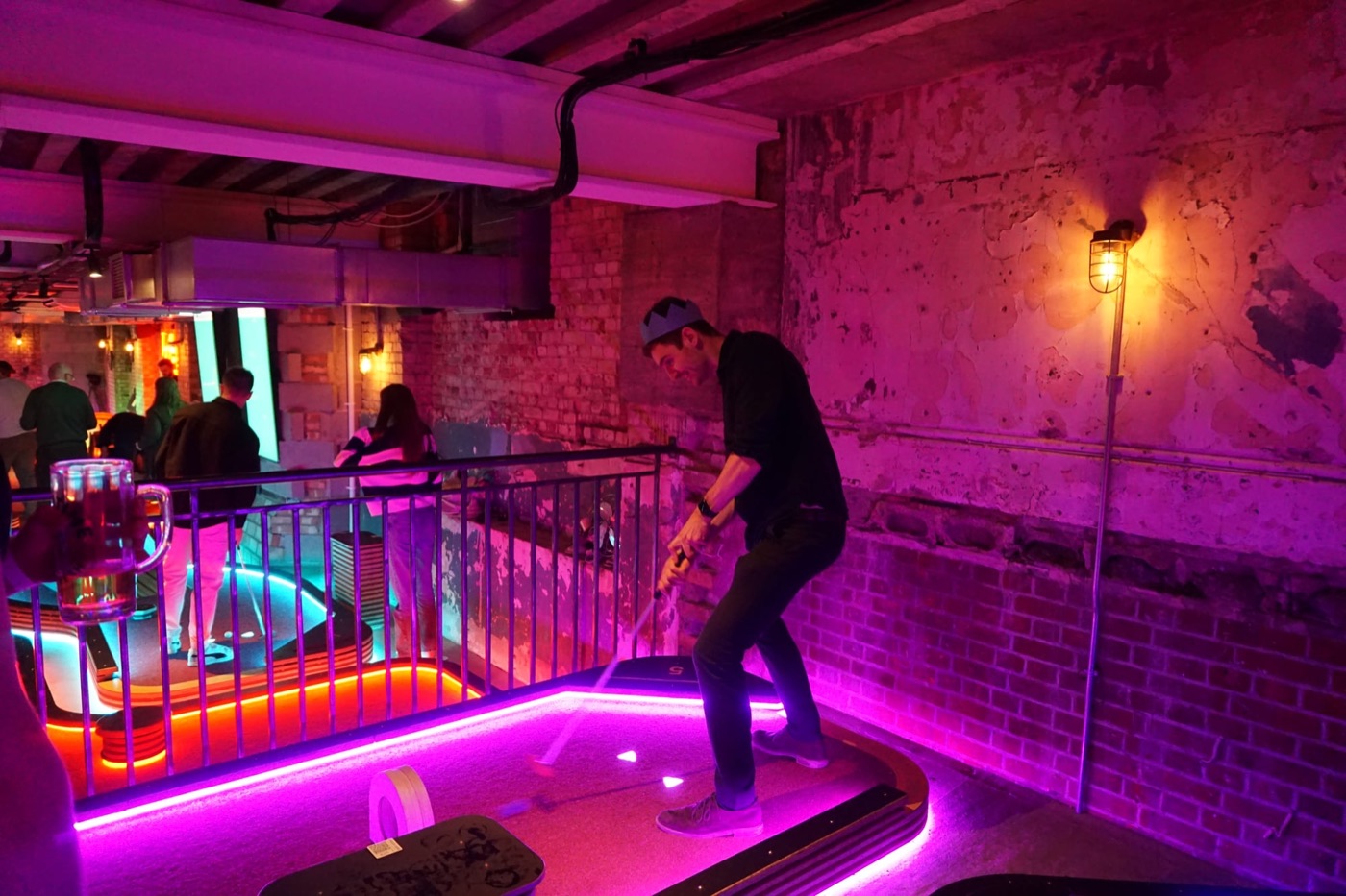 Playing mini golf at the Christmas party