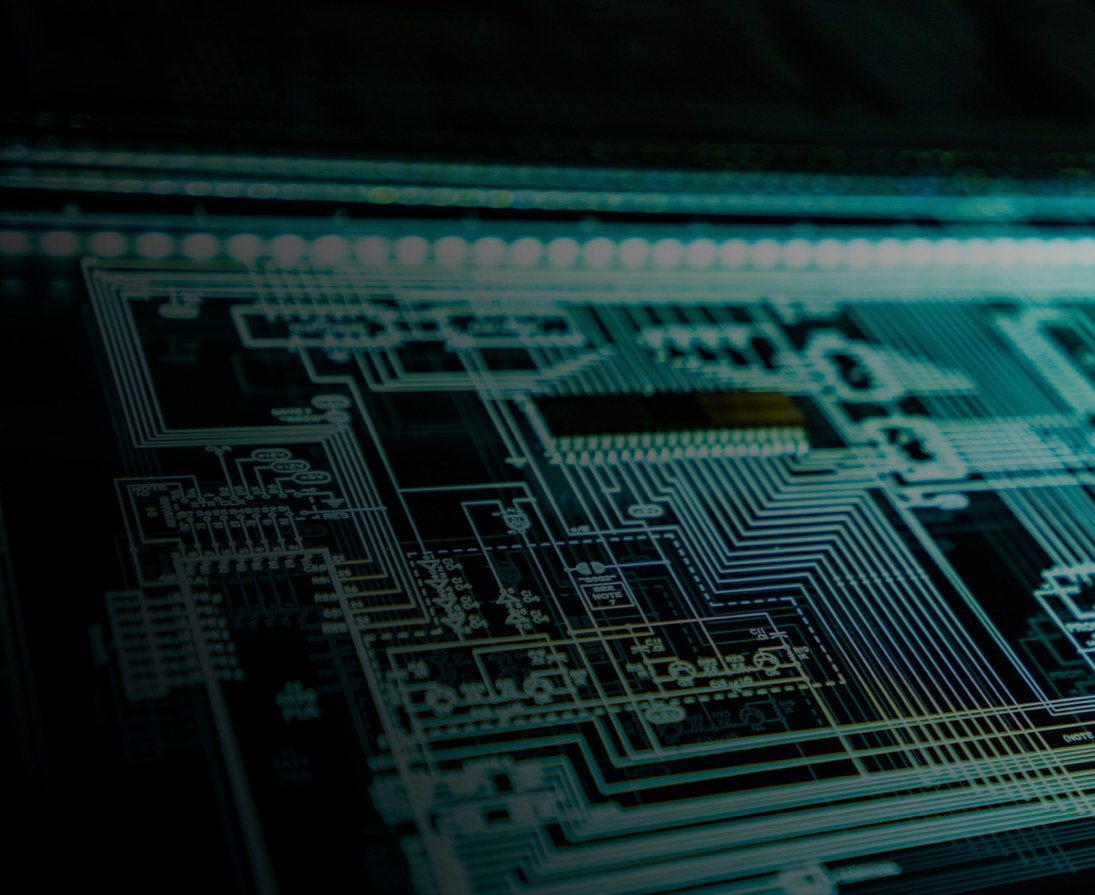 A circuit board lit in teal