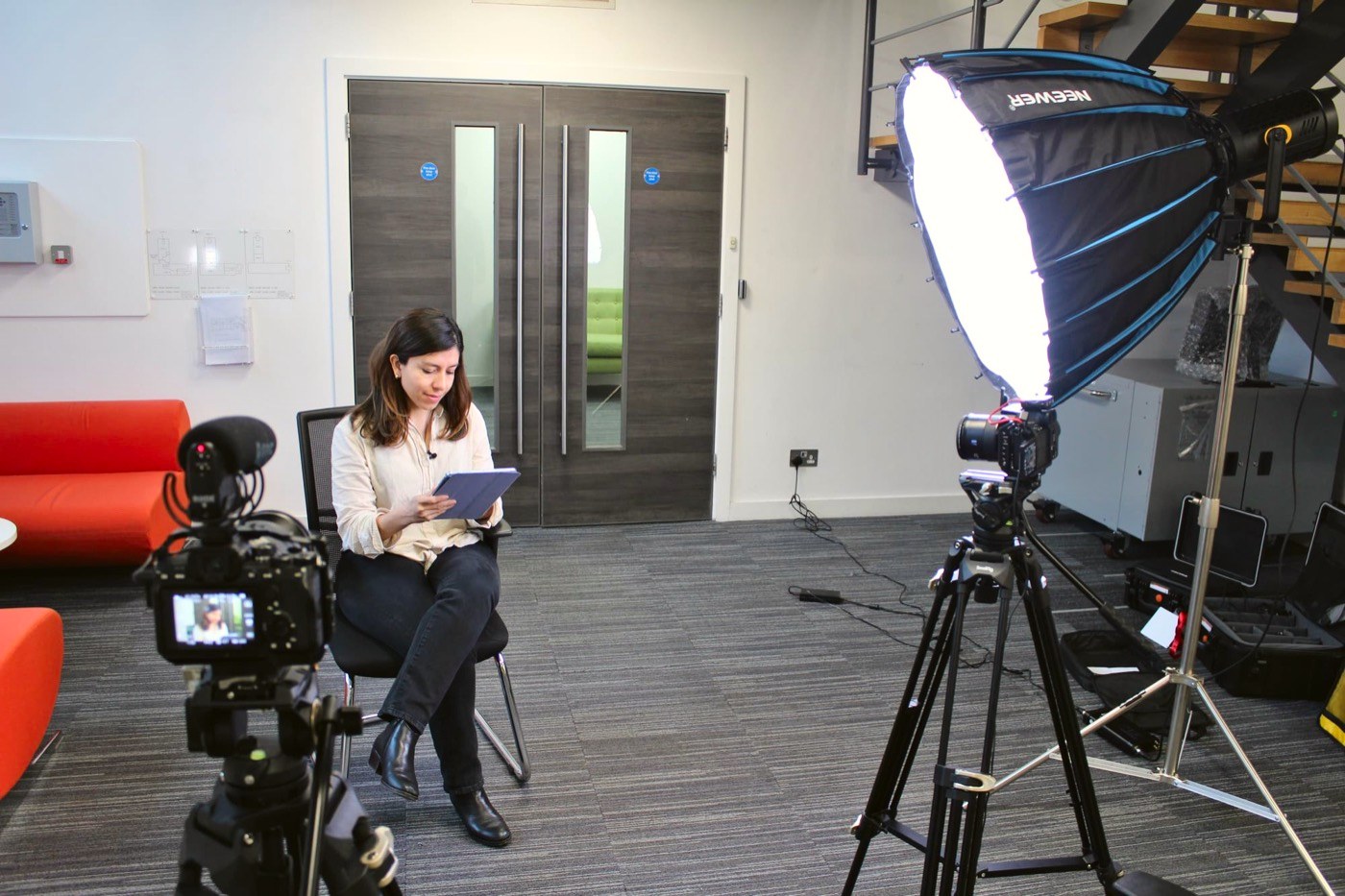 Laura being filmed in our office
