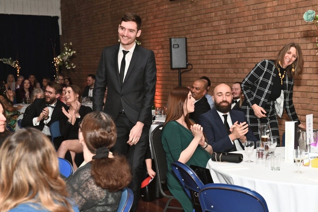 Jason getting up to collect the award at the Hunts SME Business Awards 2021