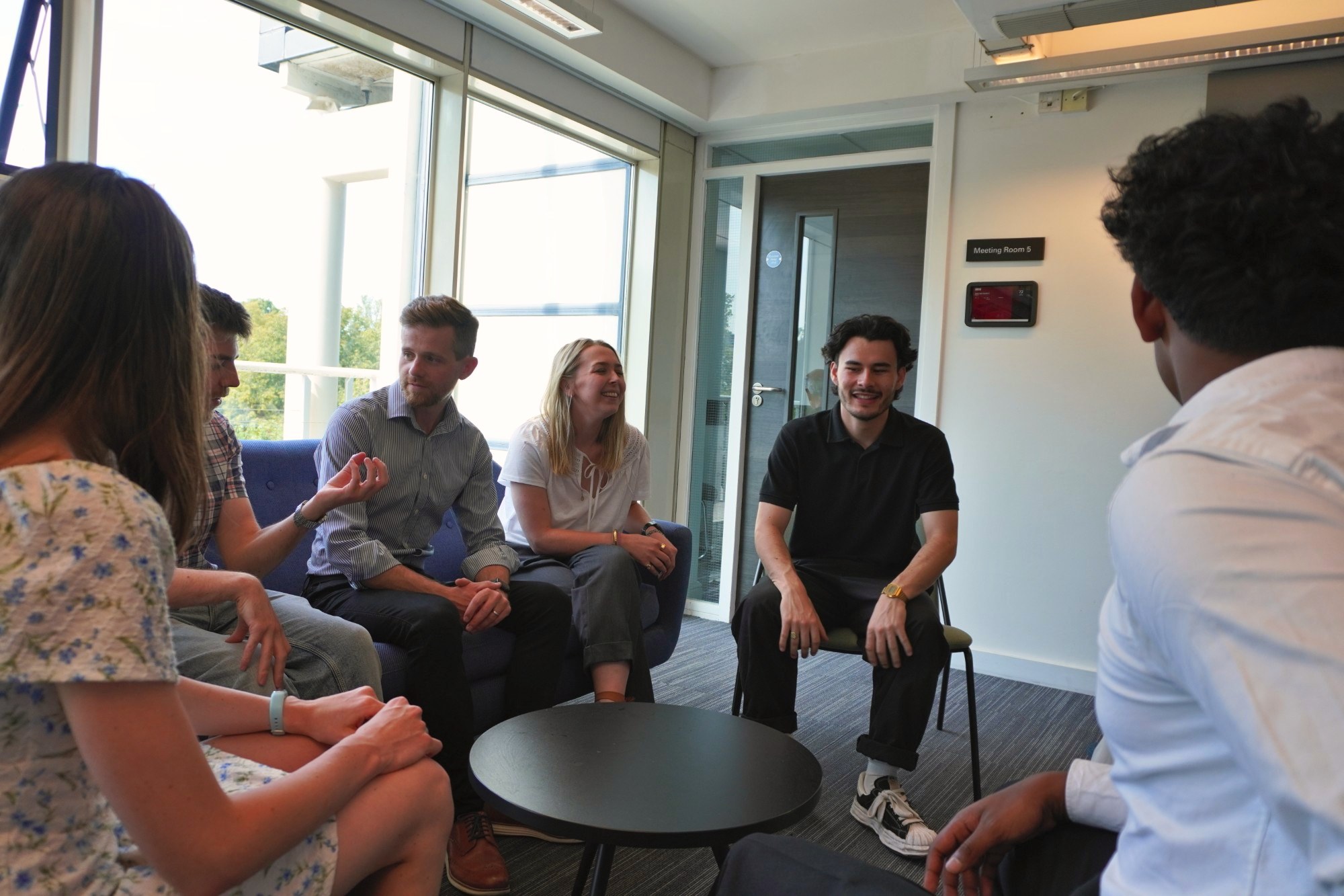 Our team talking together in a meeting room